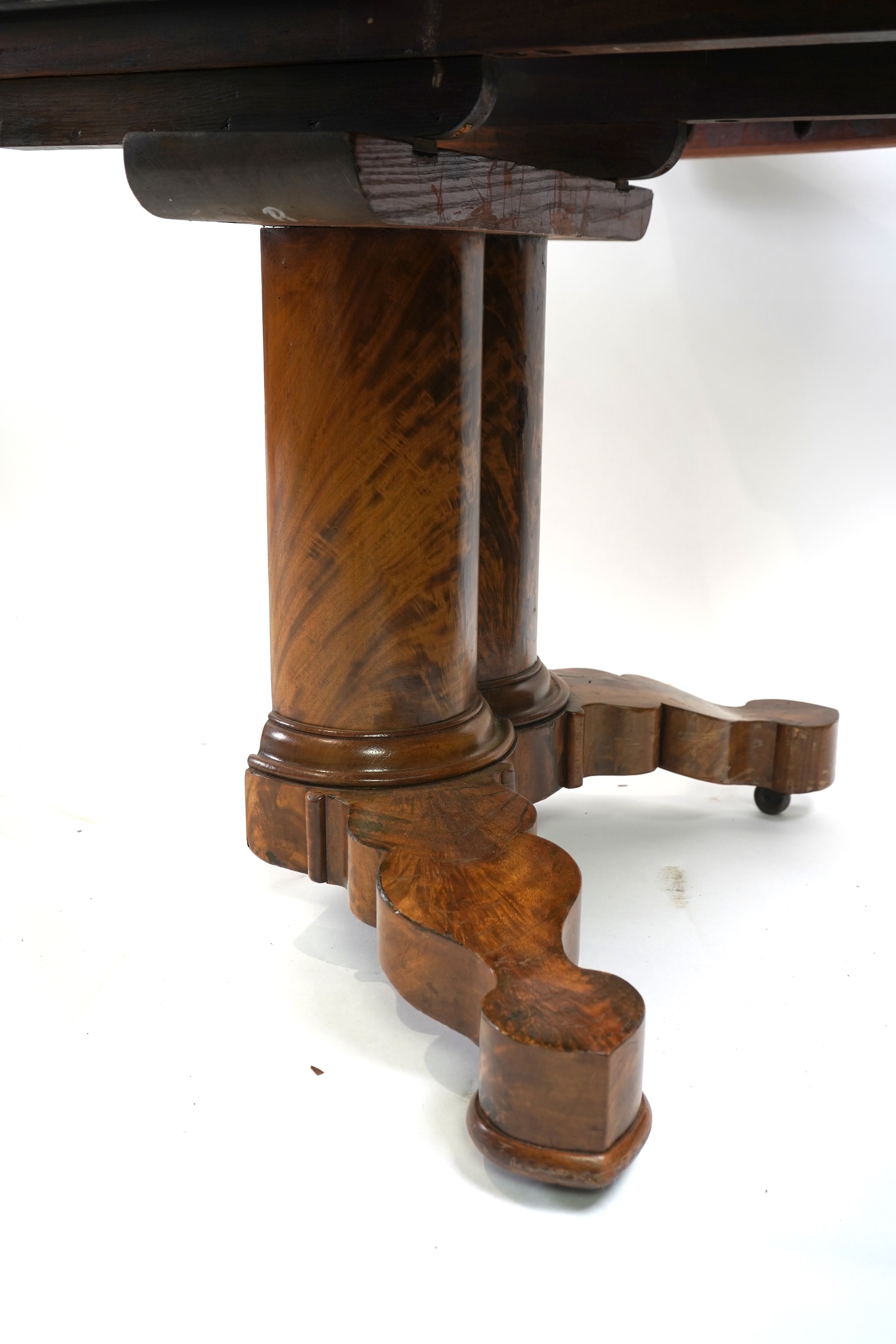 A mid 19th century Continental mahogany extending dining table